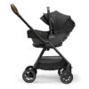 Nuna triv passeggino with magnetic buckle timber